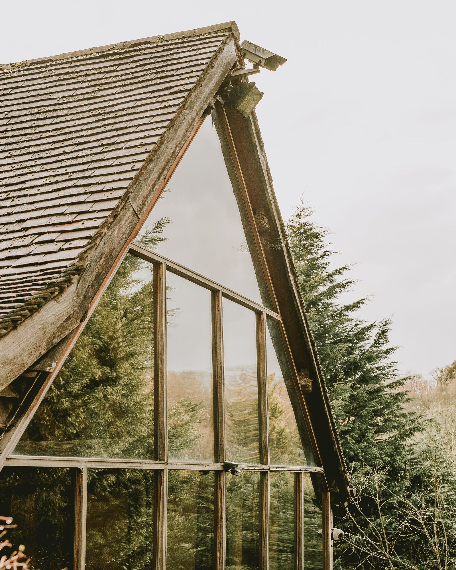 Modern glass-roofed structure with full-height glazing